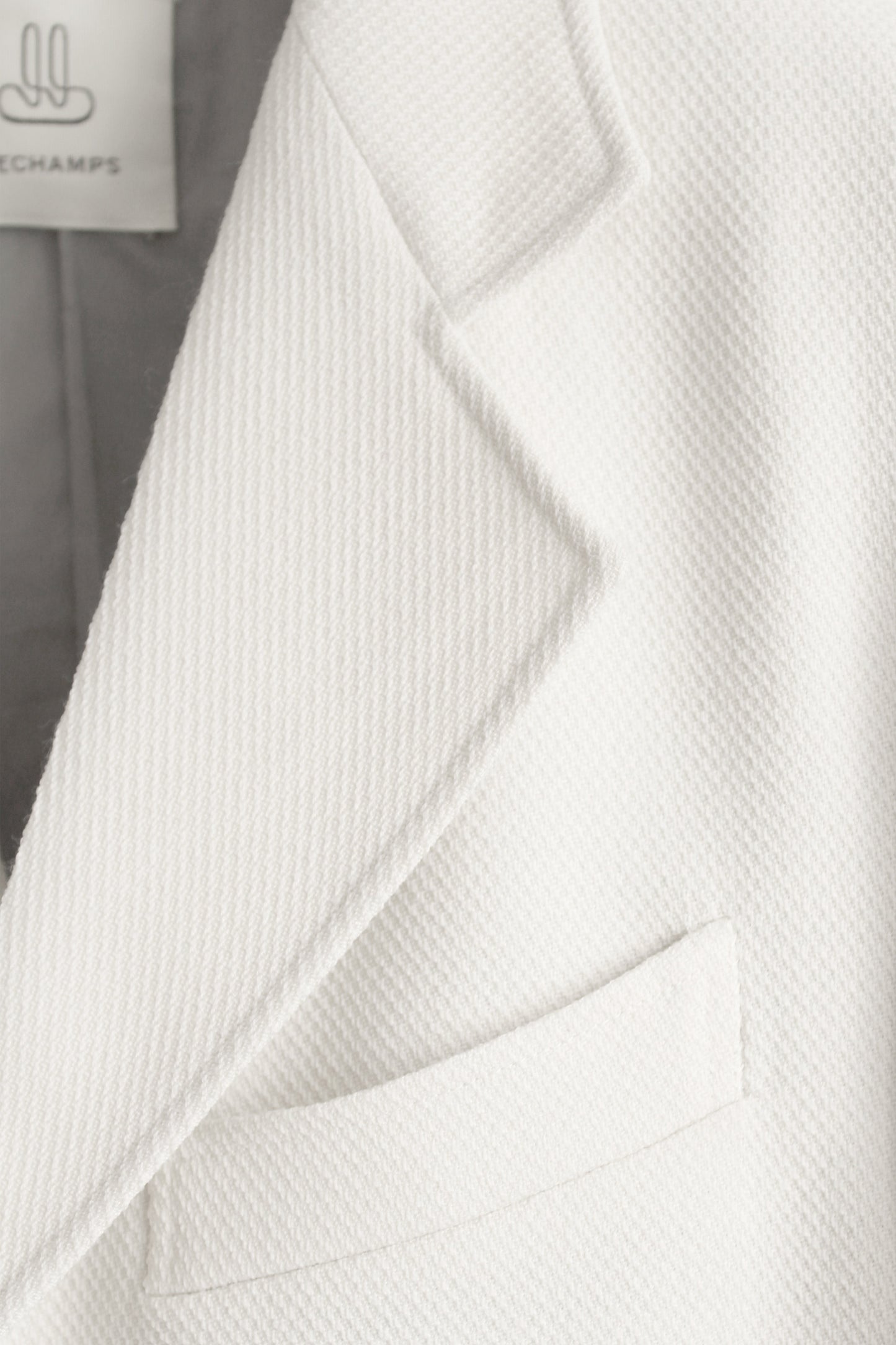 DRAPED BLAZER IN IVORY PIQUE WOOL